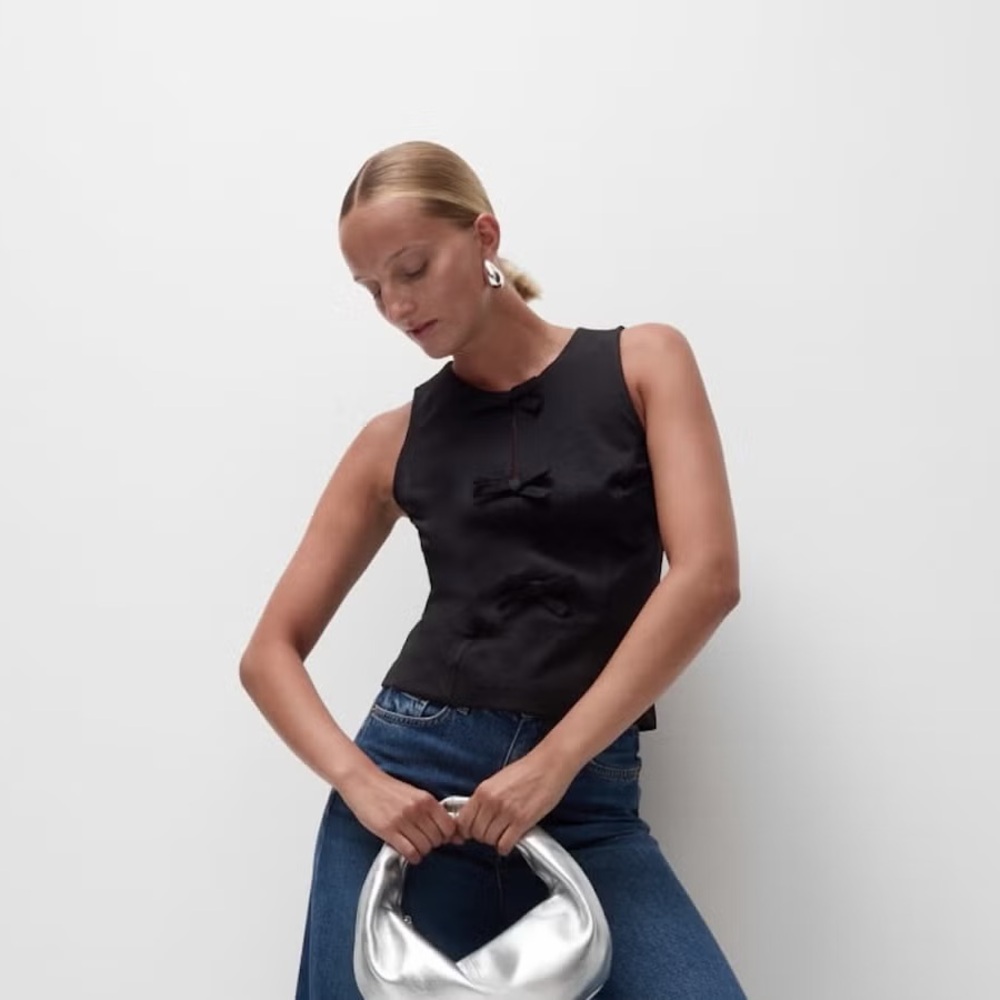 Black Sleeveless Top with Bow Accents